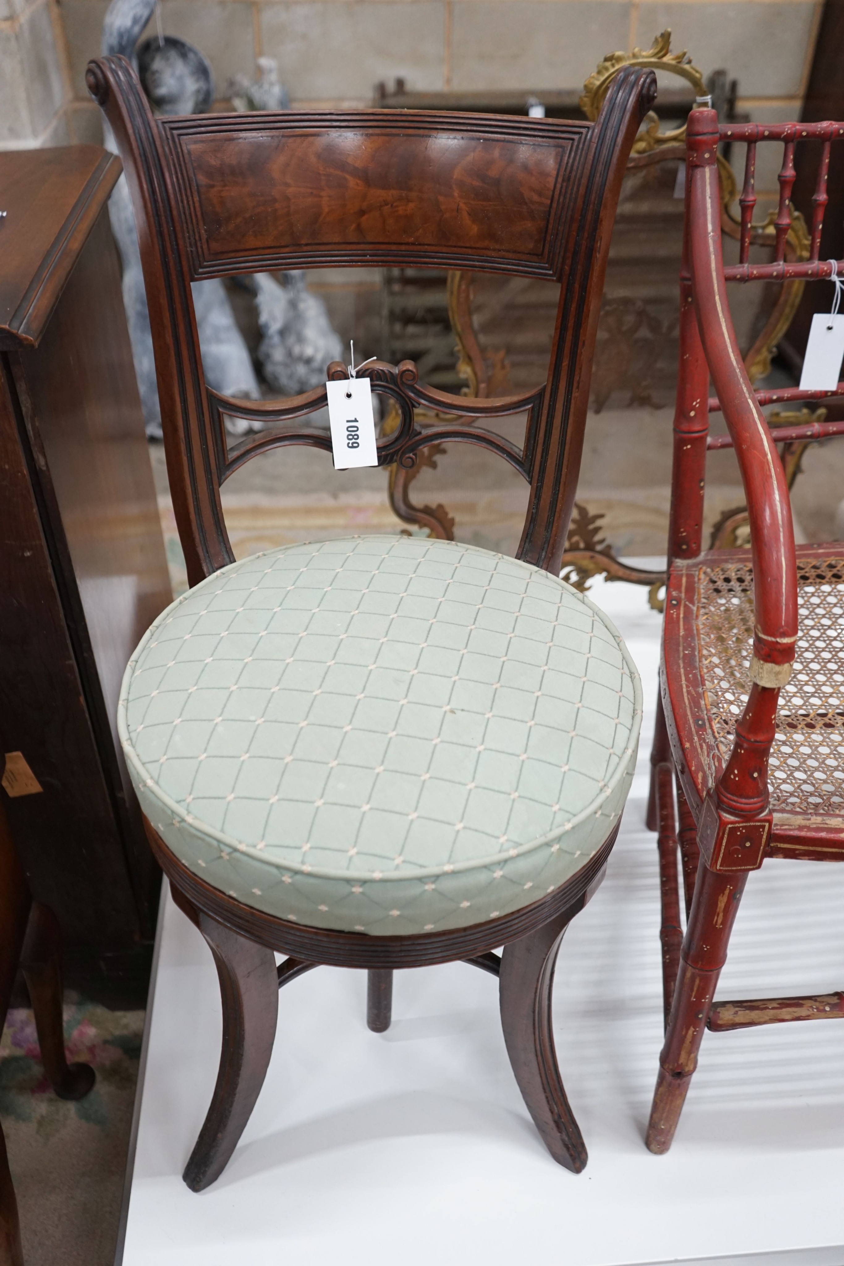 A Regency mahogany music chair with a revolving seat